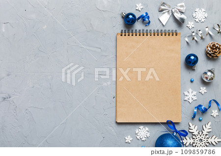 Christmas blank greeting card mock-up scene. Creative layout made of Christmas tree branches and paper card note. Flat lay. Nature New Year concept 109859786
