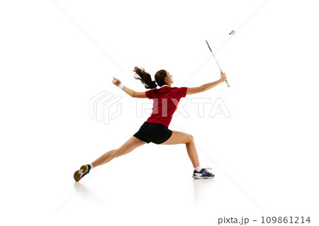 Badminton female athlete in motion, displaying attack and defense skills with finesse against white studio background. Concept of sport. Badminton female athlete in motion, displaying attack and defense skills with finesse against white studio background. Concept of sport. 109861214