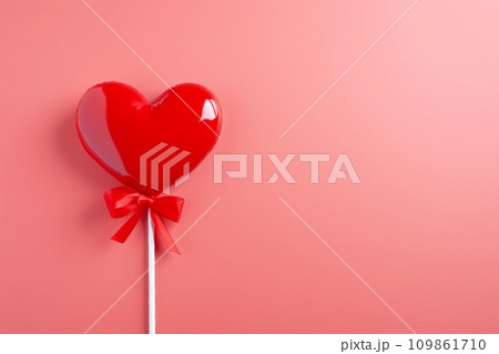 Heart shaped candy on a stick on pink background with copy space. Valentine's Day celebration. AI generated. Heart shaped candy on a stick on pink background with copy space. Valentine's Day celebration. AI generated. 109861710