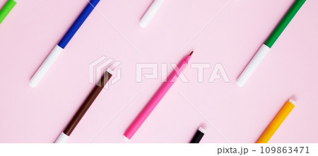 Set of multicolored felt-tip pens on pink background. Back to school. Flat lay Set of multicolored felt-tip pens on pink background. Back to school. Flat lay 109863471