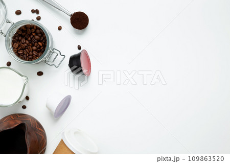 Ingredients for making coffee. Making coffee in clay cezve with milk or coffee machine capsules. Coffee making concept. Flat Lay. Top view. Copy space 109863520