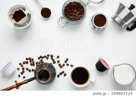 Ingredients for making coffee. Different ways to make coffee geyser moka maker, metal cezve, coffee machine capsules, drip. Coffee making concept. Flat Lay. Top view. Copy space Ingredients for making coffee. Different ways to make coffee geyser moka maker, metal cezve, coffee machine capsules, drip. Coffee making concept. Flat Lay. Top view. Copy space 109863524