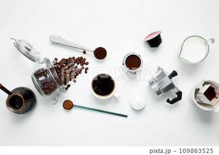 Ingredients for making coffee. Different ways to make geyser moka coffee maker, metal cezve, machine capsules. Coffee making concept. Flat Lay. Top view 109863525