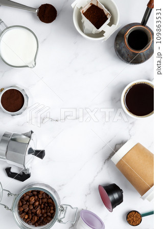 Ingredients for making coffee. Different ways to make coffee geyser moka maker,  metal cezve, coffee machine capsules, drip. Coffee making concept. Flat Lay. Top view. Copy space 109863531