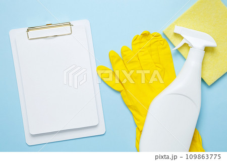 Various accessories cleaning products, sprays, rags, sponges and brushes. Mock up white clipboard. Top view, flat lay, copy space Various accessories cleaning products, sprays, rags, sponges and brushes. Mock up white clipboard. Top view, flat lay, copy space 109863775