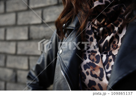 Woman wearing Rock'n'roll leather jacket. Closeup shot. Selective foucus on the details 109865137
