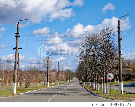 A rural road with a speed limit sign. A rural road with a speed limit sign. 109865325