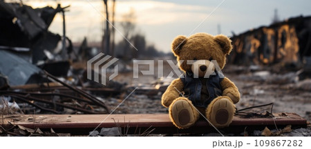 a teddy bear sitting on a broken path a teddy bear sitting on a broken path 109867282