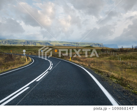 Highway road and mountain view during auto trip in Iceland. Spectacular Icelandic landscape with  scenic nature 109868147