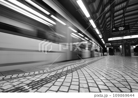 Greyscale long shutter speed shot of an empty train station in Gelsenkirchen, Germany 109869644