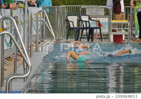 Athletes swimming in the pool during a triathlon competition in Germany 109869651