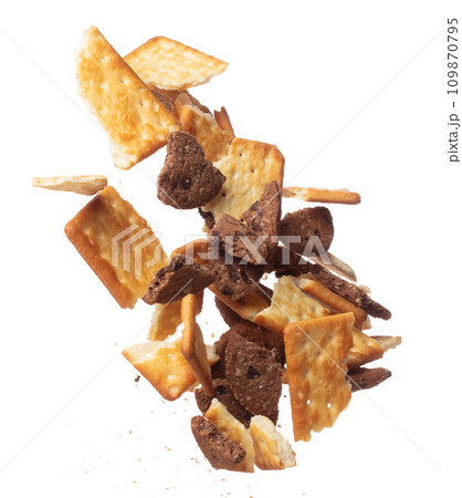Mixed Cracker Butter Cookie Chocolate chip fall fly in mid air, cookie cracker floating. Mixed Cracker Butter Cookie Chocolate chip crack crunch throw in air. White background isolated freeze motion 109870795