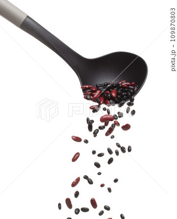 Mix black red beans fall down explosion, several kind bean float pouring in ladle. Dried red black mixed beans splash throwing in Air. White background Isolated high speed shutter freeze motion 109870803