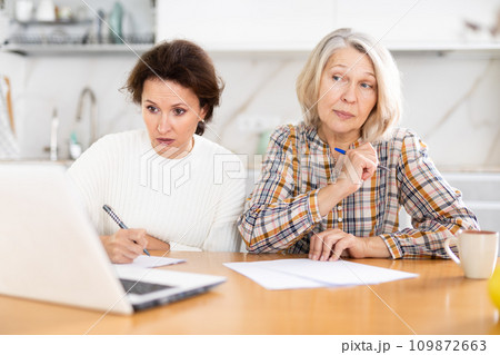 Old and middle-aged women joining distant education using laptop 109872663