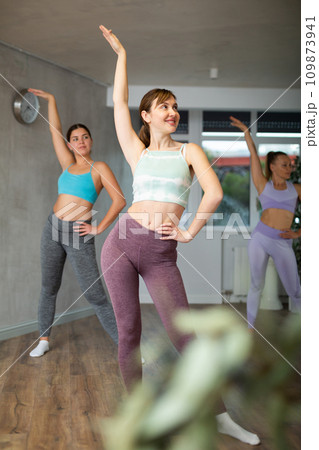 Different ages women learning swing steps at dance class Different ages women learning swing steps at dance class 109873941