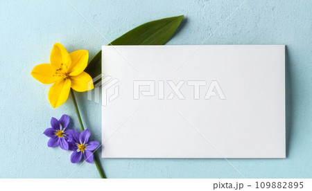 Empty white paper blank, flowers, branches on blue background. Wedding branding mock up, holiday marketing concept. 109882895
