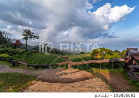 landscape and travel concept with stone ladder and cloudy sky with mountain layer background landscape and travel concept with stone ladder and cloudy sky with mountain layer background 109886092