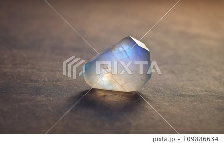 Natural precious moonstone on a brown background. Natural stone adularia 109886634