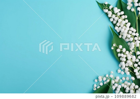 Lily of the valey bunch on blue mint background top view 109889682