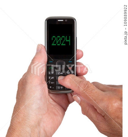 Typing on an old mobile phone, 2024 Typing on an old mobile phone, 2024 109889922