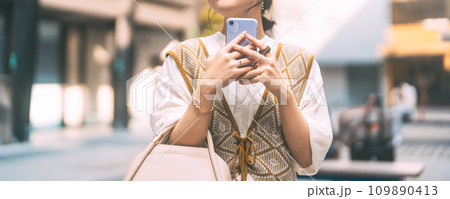 Casual business asian woman using smartphone city lifestyles with modern technology 109890413