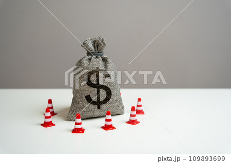 Dollar money bag blocked by road cones. Freezing of accounts and sanctions on capital. Dedollarisation. Suspicious funds with unknown sources. National money reserve. Dollar money bag blocked by road cones. Freezing of accounts and sanctions on capital. Dedollarisation. Suspicious funds with unknown sources. National money reserve. 109893699