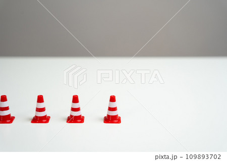 The end of a row of traffic cones on a white background. Provide new sanctions and restrictions. Laws and regulations. Bans and taboo. Stop work, freeze and cancel. Block VPN services. 109893702