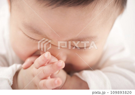 asian baby boy lying on bed asian baby boy lying on bed 109893820