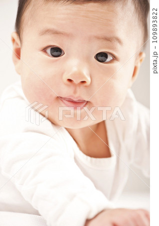 asian baby boy lying on bed 109893822