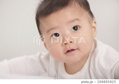 asian baby boy lying on bed asian baby boy lying on bed 109893825