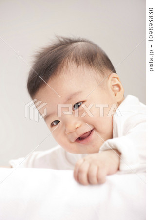 asian baby boy lying on bed asian baby boy lying on bed 109893830