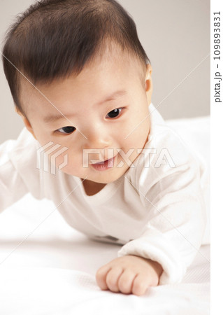asian baby boy lying on bed asian baby boy lying on bed 109893831