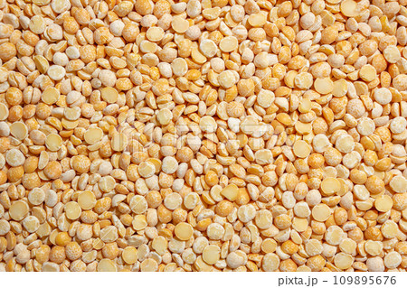 Uncooked Polished Split Peas Background Uncooked Polished Split Peas Background 109895676