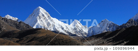 White painted Mount Pumo Ri and distant view of the Everest Base Camp, Nepal. 109896944