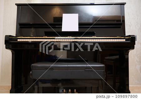 Full length still life shot of old vintage classical wooden piano in interior. 109897800