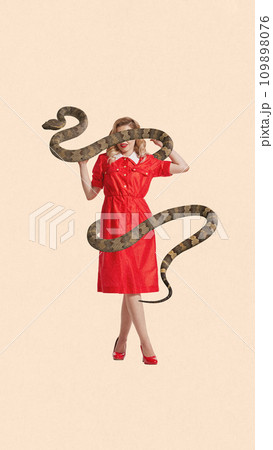 Contemporary art collage. Full length portrait of young woman wearing long red dress and snake wrapped her body and covered eyes against peach background. Contemporary art collage. Full length portrait of young woman wearing long red dress and snake wrapped her body and covered eyes against peach background. 109898076