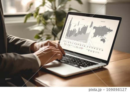 Male Investor Reviewing Economic Data Online 109898127