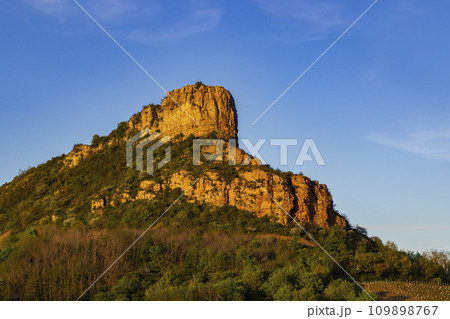 Rock of Solutre with vineyards, Burgundy, Solutre-Pouilly, France Rock of Solutre with vineyards, Burgundy, Solutre-Pouilly, France 109898767