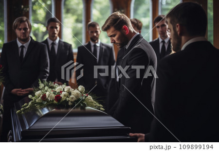 Death, funeral and family touching coffin in a church, sad and unhappy while gathering to say farewell. Church service casket and sad man and woman looking upset while greeting, goodbye and rip Death, funeral and family touching coffin in a church, sad and unhappy while gathering to say farewell. Church service casket and sad man and woman looking upset while greeting, goodbye and rip 109899194