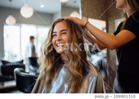 Portrait of a happy woman at the hair salon 109901310