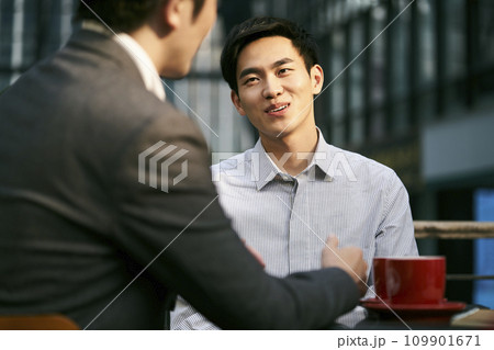 asian business men meeting in outdoor cafe asian business men meeting in outdoor cafe 109901671