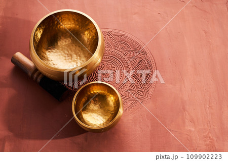 A close up of a tibetan singing bowl or himalayan bowl for therapy, meditation and relaxation. 109902223