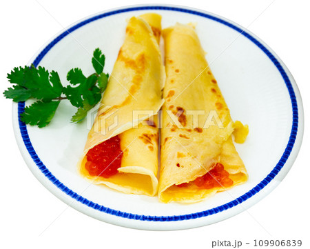 Pancakes with red caviar served on platter 109906839