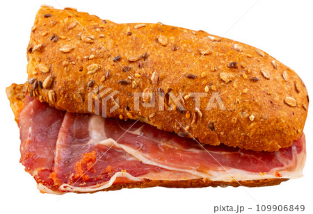 Sandwiches bocadillo from fresh baguette filled with sliced ham. Spanish food Sandwiches bocadillo from fresh baguette filled with sliced ham. Spanish food 109906849