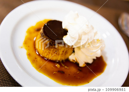 Creamy flan served on platter for dessert 109906981