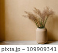 ベージュ色の壁とおしゃれな生け花1 109909341