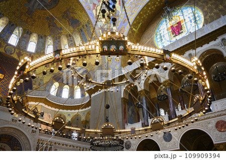 Large gilded chandelier with icons in St. Nicholas Cathedral in Kronstadt, Russia, built in 1913 Large gilded chandelier with icons in St. Nicholas Cathedral in Kronstadt, Russia, built in 1913 109909394