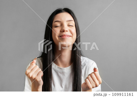 Portrait of a young girl who rejoices in success. 109911161