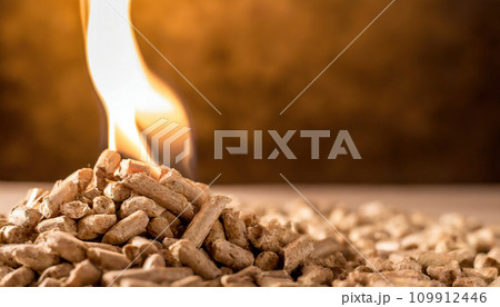 Burning Elegance: Enchanting Flames Embrace Wood Pellet Pile Burning Elegance: Enchanting Flames Embrace Wood Pellet Pile 109912446