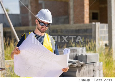 Professional construction worker engineer male. Real estate house project builder. Smart architect man standing work in construction site. Professional construction worker engineer male. Real estate house project builder. Smart architect man standing work in construction site. 109912744
